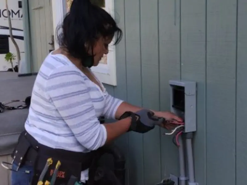 Licensed electrician wiring an exterior subpanel in Murphysboro